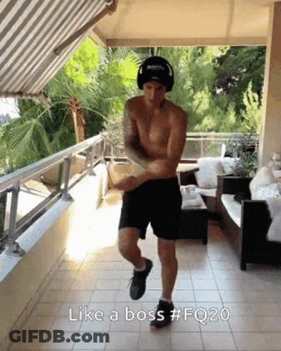 A Shirtless Man Is Dancing On A Balcony With The Caption Like A Boss GIF