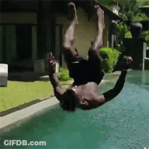 A Shirtless Man Is Doing A Handstand In A Pool GIF