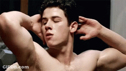 A Shirtless Man Is Doing Exercises With His Hands Behind His Head In A Bathroom . GIF