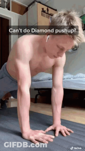 A Shirtless Man Is Doing Push Ups On A Yoga Mat With The Caption " Can 'T Do Diamond Pushup " GIF