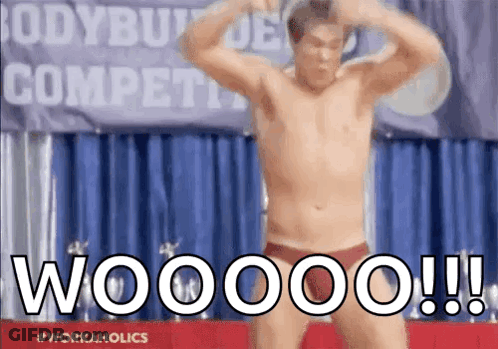 A Shirtless Man Is Flexing His Muscles In Front Of A Banner That Says Bodybuilder Competition GIF