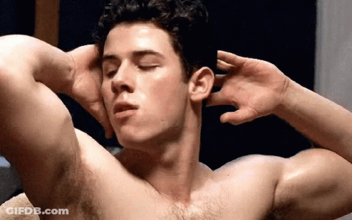 A Shirtless Man Is Flexing His Muscles With His Eyes Closed And His Hands On His Head . GIF