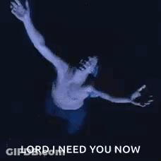 A Shirtless Man Is Floating In The Water With His Arms Outstretched And The Words `` Lord I Need You Now '' . GIF