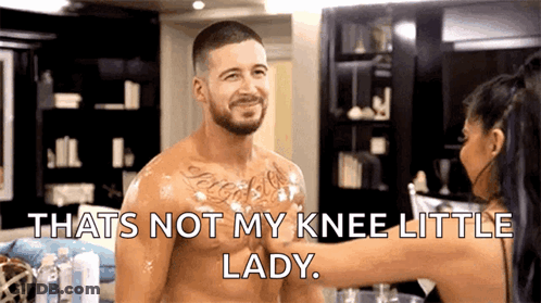 A Shirtless Man Is Getting A Massage From A Woman Who Says That 'S Not My Knee Little Lady GIF