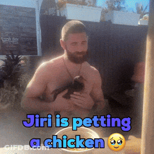 A Shirtless Man Is Holding A Chicken In His Arms With The Caption Jiri Is Petting A Chicken GIF
