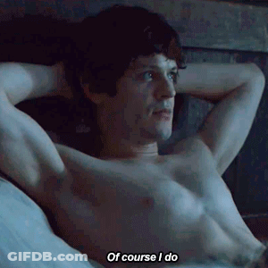 A Shirtless Man Is Laying On A Bed And Saying Of Course I Do GIF