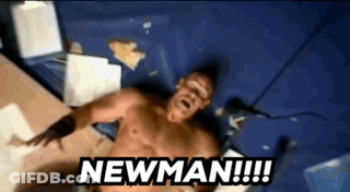 A Shirtless Man Is Laying On A Bed With The Words Newman Written Above Him GIF