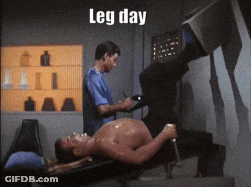 A Shirtless Man Is Laying On A Bench While Another Man Writes On A Clipboard With The Words Leg Day Below Him GIF