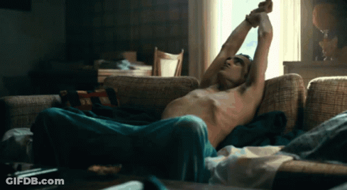 Shirtless Man Lying On Couch GIF