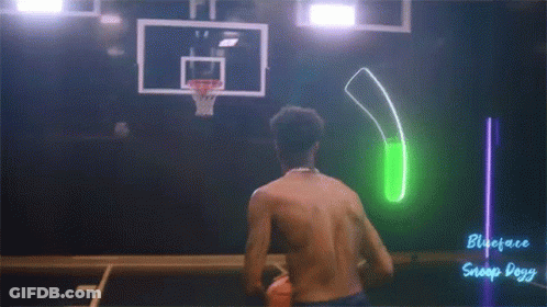 A Shirtless Man Is Playing A Game Of Basketball With A Green Light Behind Him That Says Snoop Dogg On It GIF