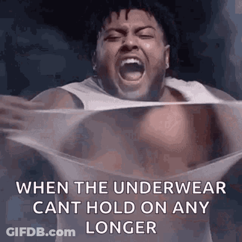 A Shirtless Man Is Screaming While Holding A Piece Of Plastic . GIF
