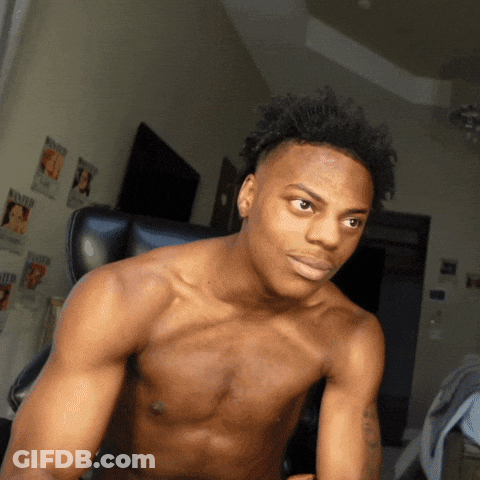 A Shirtless Man Is Sitting In A Chair In Front Of A Wall With Wanted Posters GIF