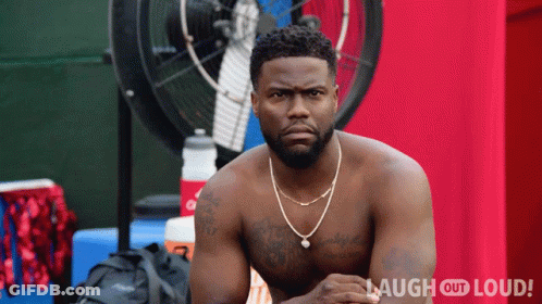 A Shirtless Man Is Sitting In Front Of A Fan With Laugh Out Loud Written On The Bottom Right GIF