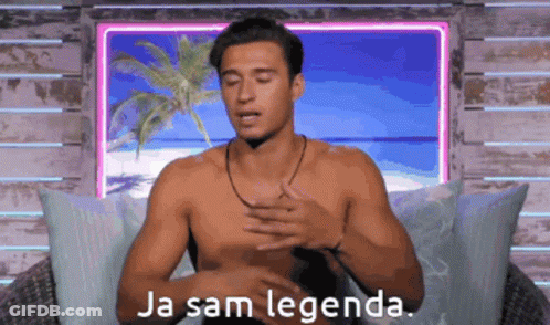 A Shirtless Man Is Sitting In Front Of A Window With The Words Ja Sam Legenda Written On It GIF