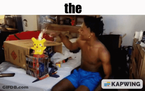 A Shirtless Man Is Sitting On A Bed With A Pikachu In A Box And A Caption That Says " The " GIF