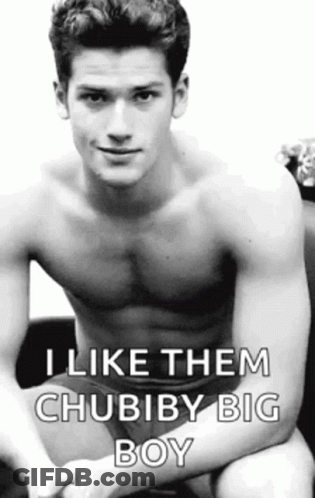 A Shirtless Man Is Sitting On A Couch With His Legs Crossed And Says `` I Like Them Chubiby Big Boy '' . GIF