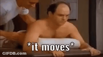 A Shirtless Man Is Sitting On A Table Getting A Massage . GIF