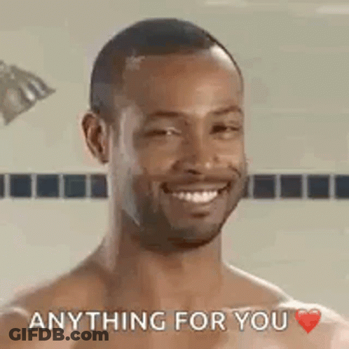 A Shirtless Man Is Smiling And Saying `` Anything For You '' In A Shower . GIF