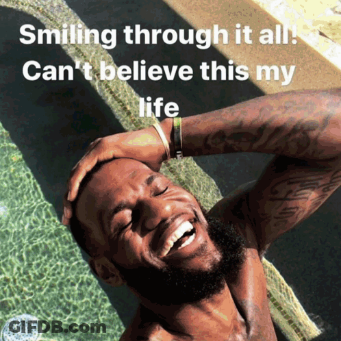 A Shirtless Man Is Smiling In A Pool With The Words Smiling Through It All Can 'T Believe This My Life Below Him GIF