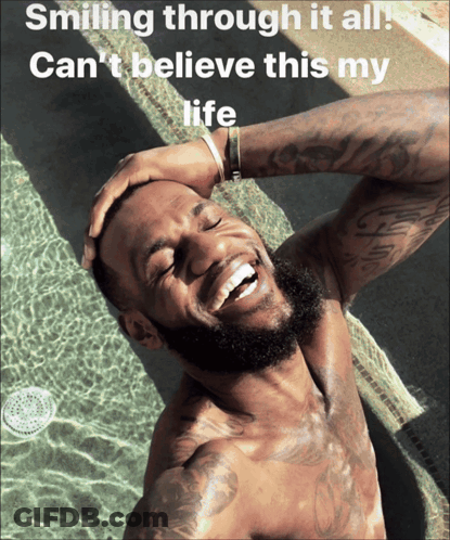 A Shirtless Man Is Smiling In Front Of A Pool With The Caption Smiling Through It All GIF