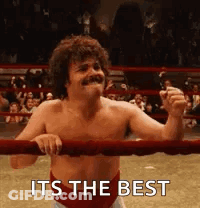A Shirtless Man Is Standing In A Boxing Ring With The Words `` It 'S The Best '' Written Above Him . GIF