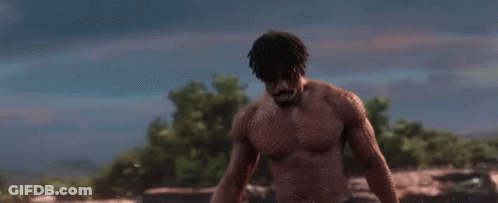 A Shirtless Man Is Standing In A Field With The Words `` Is This Your King '' . GIF