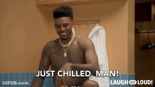 A Shirtless Man Is Standing In A Locker Room And Says Just Chilled Man GIF