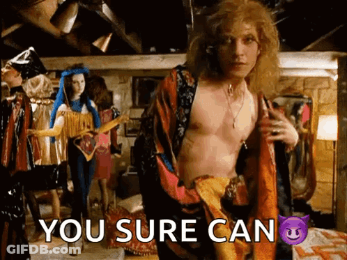 A Shirtless Man Is Standing In A Room With The Words You Sure Can Written On The Bottom GIF