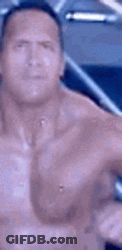 A Shirtless Man Is Standing In Front Of A Blue Background . GIF