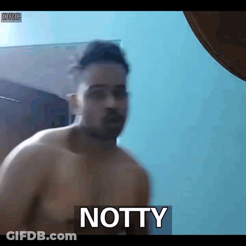 Shirtless Man Standing In Front Of Notty GIF