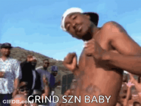 A Shirtless Man Is Standing In Front Of A Crowd With The Words Grind Szn Baby Written On The Bottom GIF