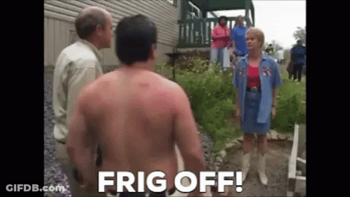 A Shirtless Man Is Standing In Front Of A Group Of People And A Woman . GIF