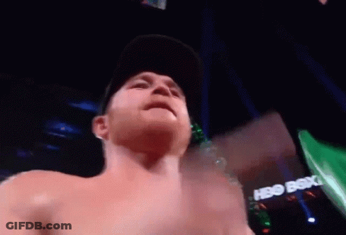 A Shirtless Man Is Standing In Front Of A Hbo Box Office Sign GIF
