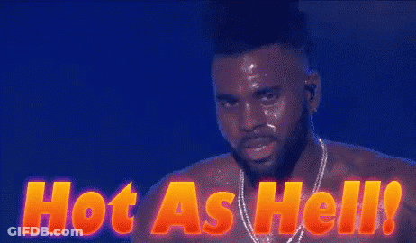 A Shirtless Man Is Standing In Front Of A Sign That Reads Hot As Hell GIF