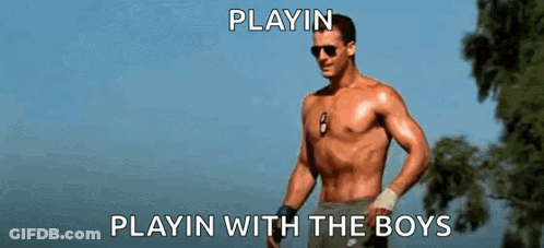 A Shirtless Man Is Standing In Front Of A Tree With The Words Playin Playin With The Boys Above Him GIF