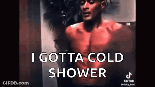 A Shirtless Man Is Standing In Front Of A Wall With The Words `` I Gotta Cold Shower '' . GIF