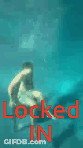 A Shirtless Man Is Standing In The Water With The Words Locked In In Red GIF