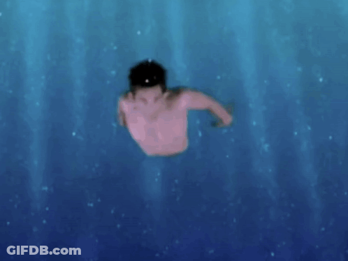 A Shirtless Man Is Swimming In A Pool GIF
