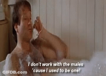 A Shirtless Man Is Taking A Bath In A Bathtub While Shaving His Beard . GIF
