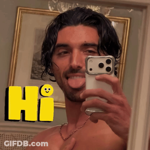 A Shirtless Man Is Taking A Selfie In Front Of A Mirror With A Yellow Hi Sticker Behind Him GIF