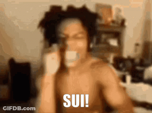 A Shirtless Man Is Talking On A Cell Phone And The Word Sui Is On The Bottom Right GIF