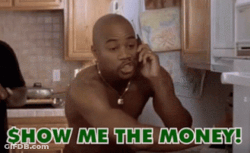 A Shirtless Man Is Talking On A Cell Phone With The Words Show Me The Money Behind Him GIF