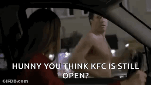 A Shirtless Man Is Talking To A Woman In A Car While Driving . GIF