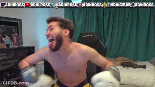 A Shirtless Man Is Wearing Boxing Gloves In Front Of A Screen That Says Finding Bae GIF