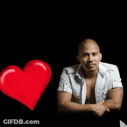 A Shirtless Man Sits In Front Of A Sign That Says R & R Music House GIF