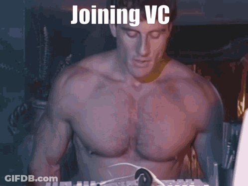 A Shirtless Man Sitting In Front Of A Computer With The Words Joining Vc Written On The Screen GIF