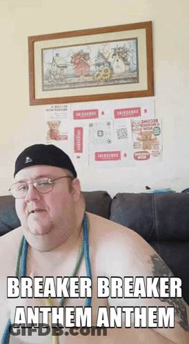 A Shirtless Man Sitting On A Couch With Breaker Breaker Anthem Anthem Written On The Bottom GIF