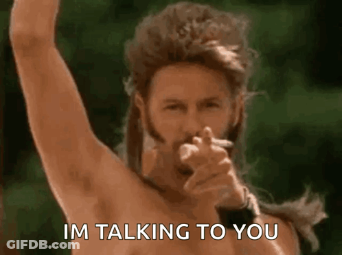 A Shirtless Man Smoking A Cigarette And Pointing At The Camera With The Words Im Talking To You Below Him GIF