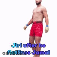 A Shirtless Man Standing In Red Shorts With The Words Jiri After He Flatlines Jamal Below Him GIF