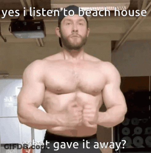 A Shirtless Man Stands In Front Of A Projector With The Caption " Yes I Listen To Beach House What Gave It Away " On The GIF